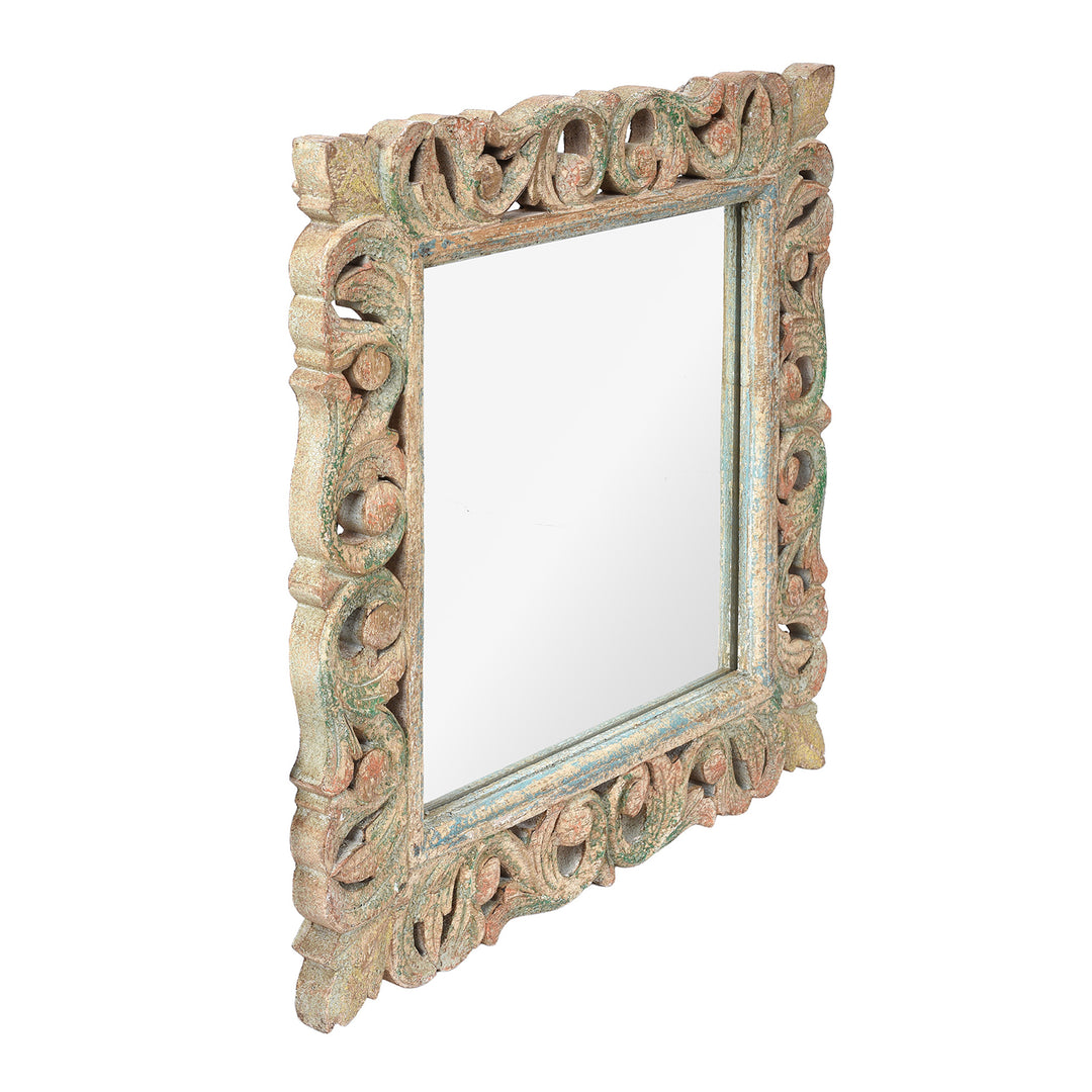 Angled VIew Of Carved Mango Wood Indian Mirror With Green And Red Painted Frame
