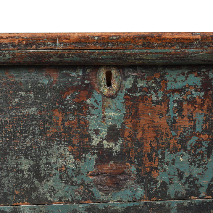 Detailed View Of Key Hole From Indian Antique Painted Teak Chest With Distressed Turquoise And Rust Patina And Iron Strap Detailing