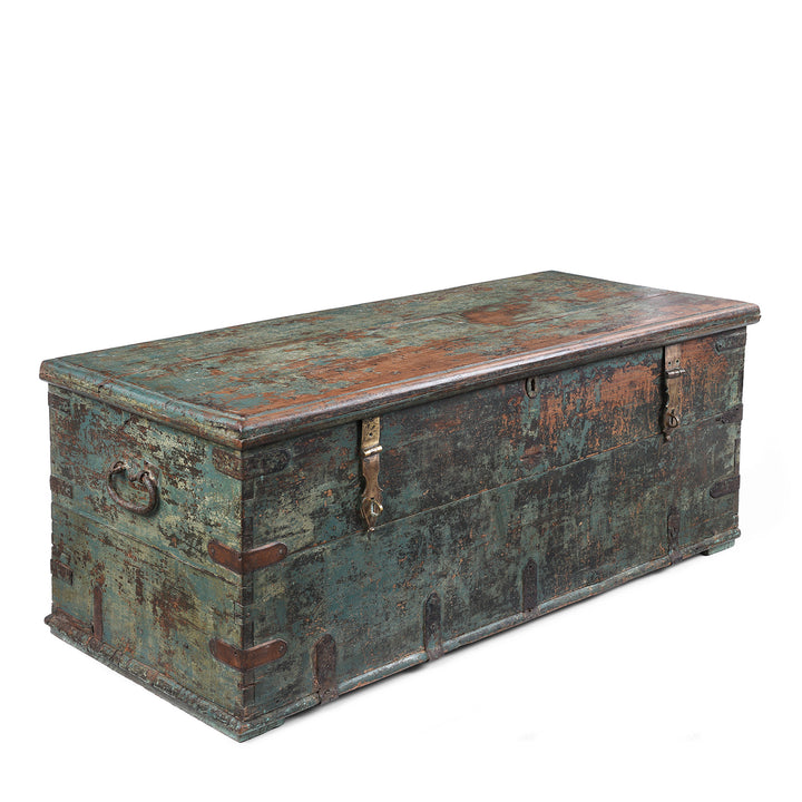 Angled View Of Indian Antique Painted Teak Chest With Distressed Turquoise And Rust Patina And Iron Strap Detailing