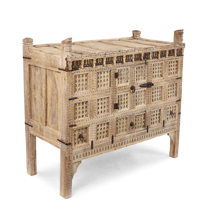 Angled View Of Bleached Teak Indian Damchiya Chest With Intricate Hand-Carved Geometric Patterns And Hidden Tribal Compartments