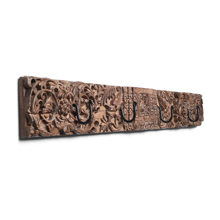 Angled View Of Indian Carved Teak Coat Hook With Floral Panels And Iron Hooks