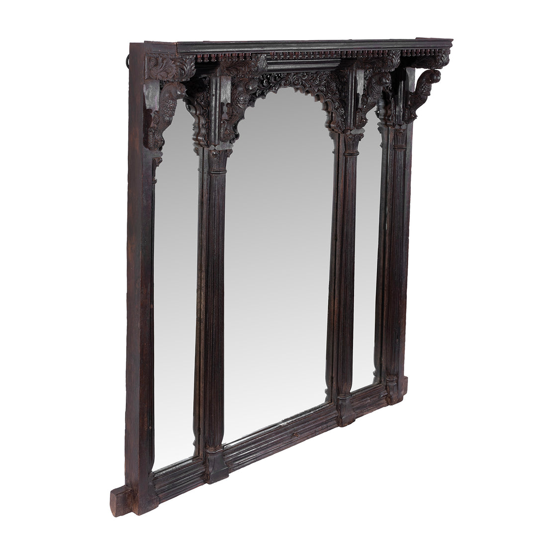 Angled VIew Of Carved Teak Triple Arch Window Mirror From Kutch With Mughal Arches And Parrot Detailing