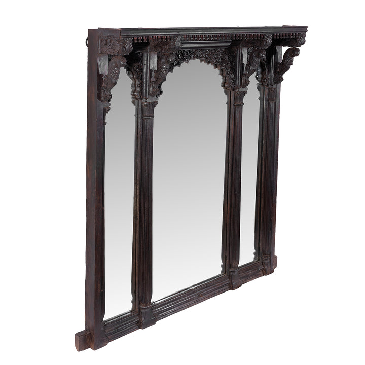 Angled VIew Of Carved Teak Triple Arch Window Mirror From Kutch With Mughal Arches And Parrot Detailing