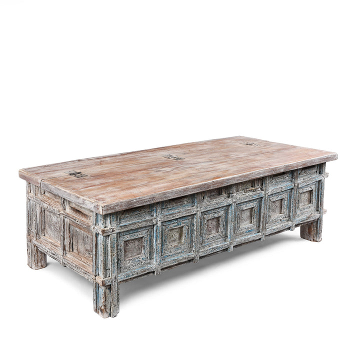 Angled View Of Reclaimed Teak Coffee Table Chest With Carved Geometric Panels And Blue Painted Weathered Patina Finish