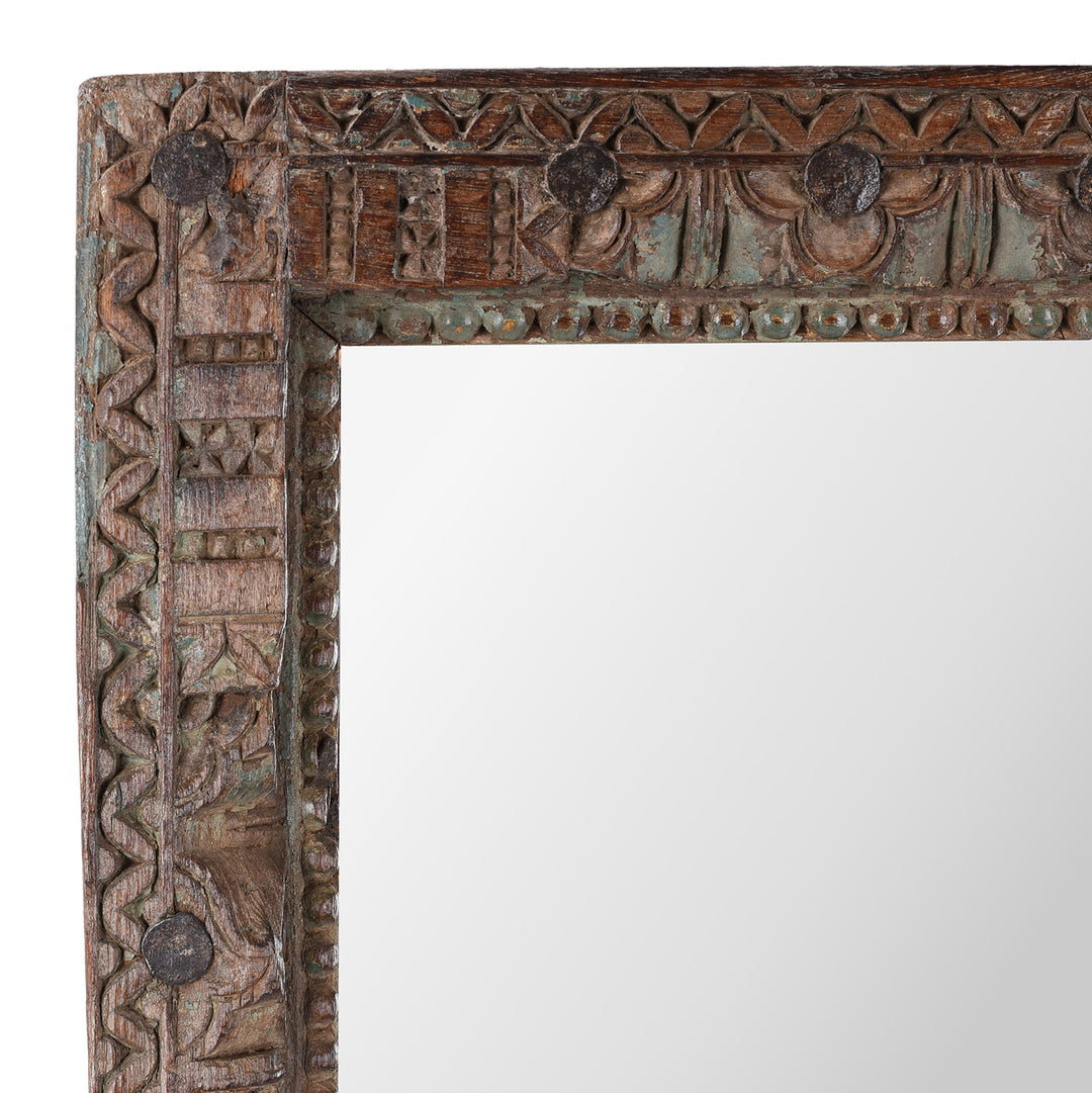Corner Detail Of Carvings On Antique Indian Teak Mirror With Intricately Carved Frame Made From Reclaimed Wood