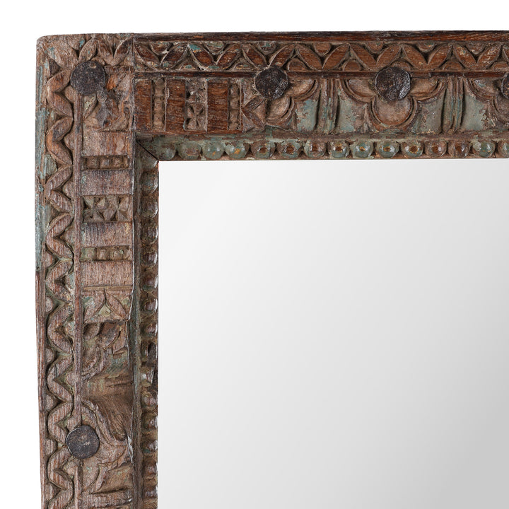 Corner Detail Of Carvings On Antique Indian Teak Mirror With Intricately Carved Frame Made From Reclaimed Wood