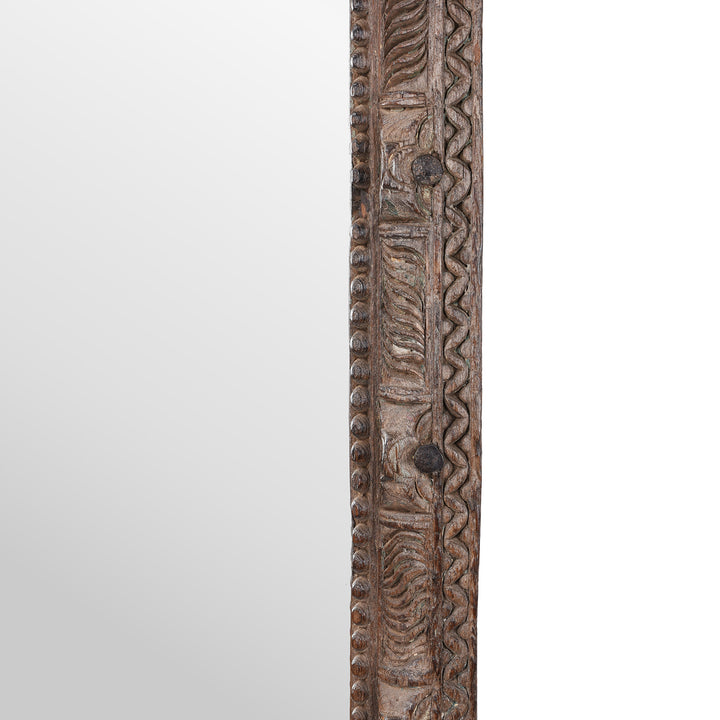 Detail Of Side Of Antique Indian Teak Mirror With Intricately Carved Frame Made From Reclaimed Wood