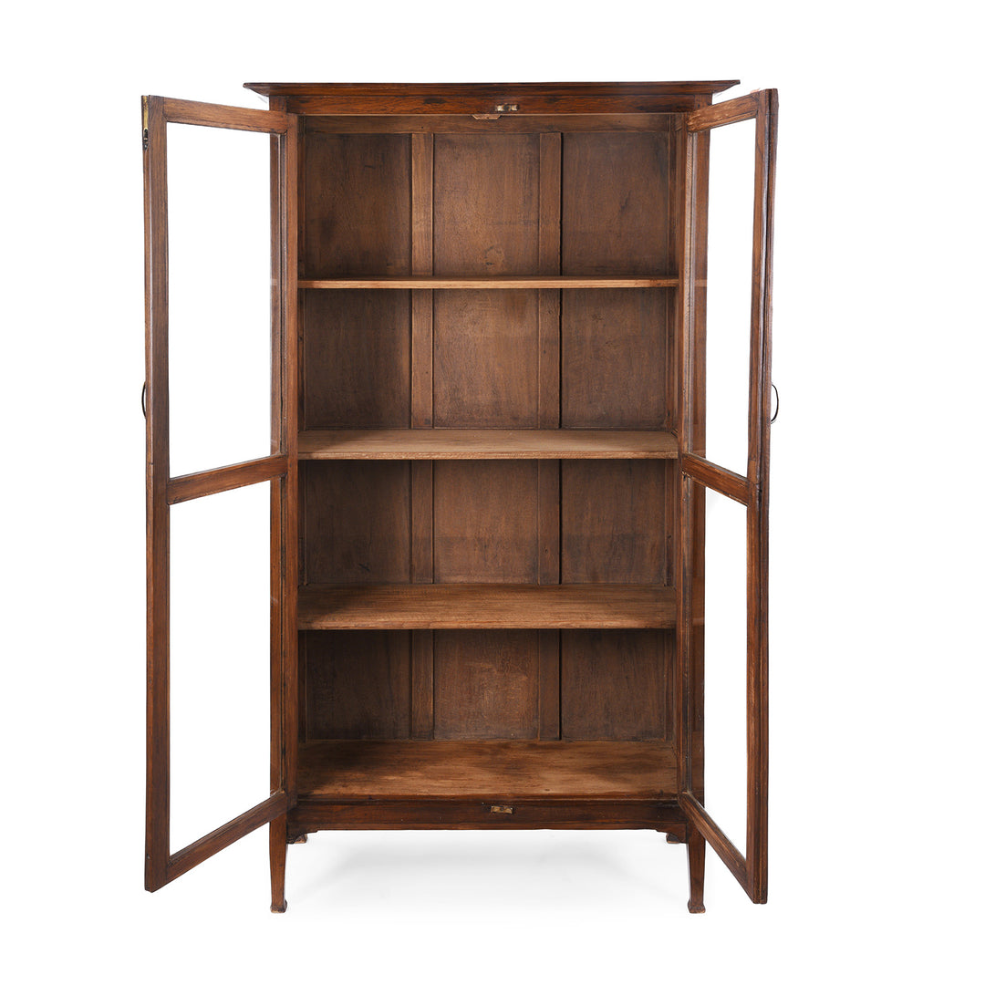 Interior View Of Antique Anglo-Indian teak book cabinet from Gujarat, circa 1910, with glazed doors and three interior shelves