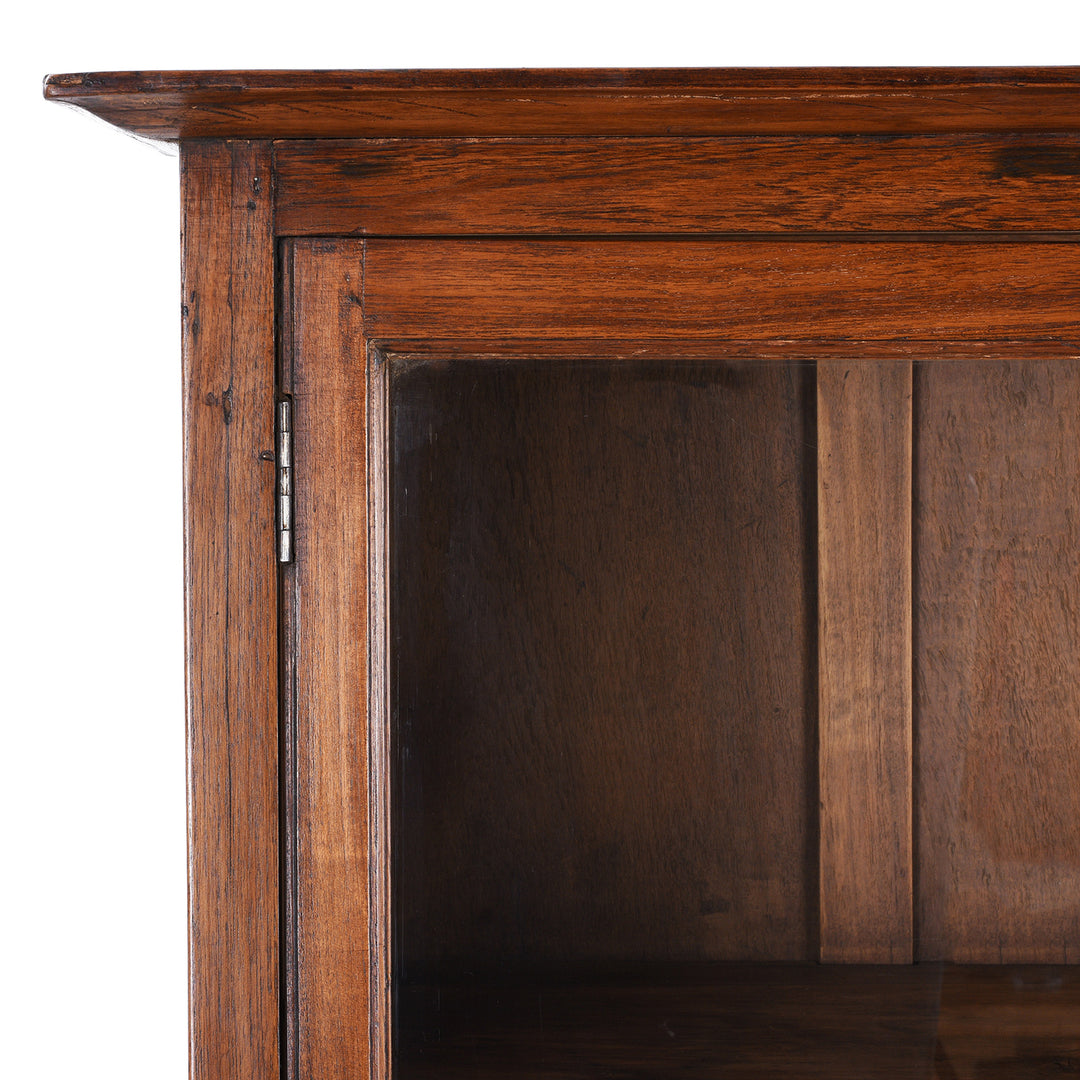 Corner Detail Showing Patina On Antique Anglo-Indian teak book cabinet from Gujarat, circa 1910, with glazed doors and three interior shelves