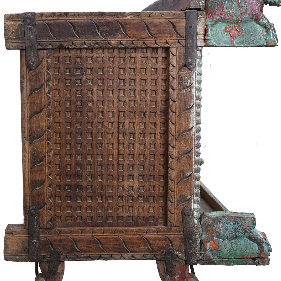 Side View Of Antique Gujarati Majus Dowry Chest With Painted Floral Carving And Horse Head Finials