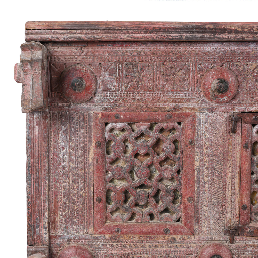 Corner Detail From Antique 19th Century Indian Majus Dowry Chest From Gujarat With Carved Panels Studs And Red Painted Finish | Indigo Antiques