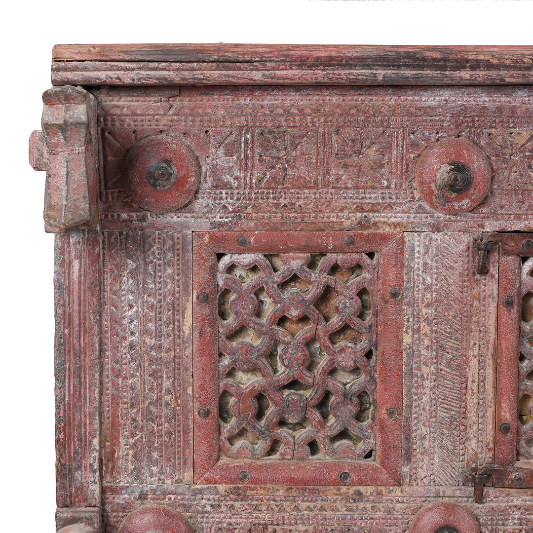 Corner Detail From Antique 19th Century Indian Majus Dowry Chest From Gujarat With Carved Panels Studs And Red Painted Finish | Indigo Antiques