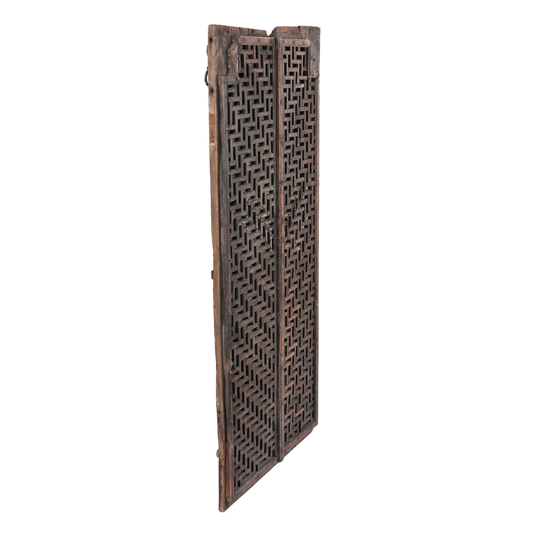 Angled View Of 18th Century Teak Temple Door From Kota Rajasthan With Intricate Geometric Latticework And Original Iron Fittings | Indigo Antiques
