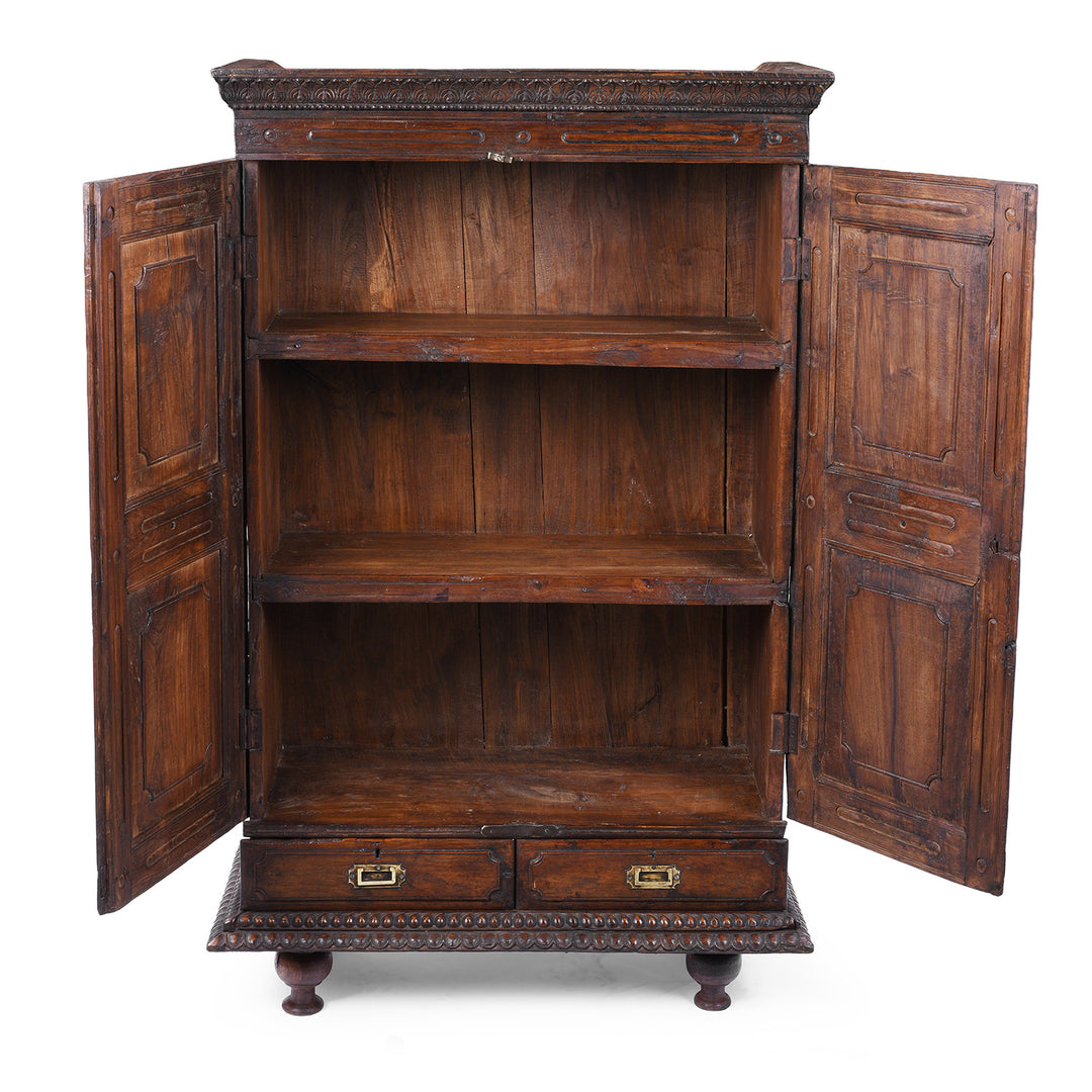 Interior Of 19th Century Indian Teak Almirah Cabinet With Deeply Carved Sunburst Panels And Indo Portuguese Influence