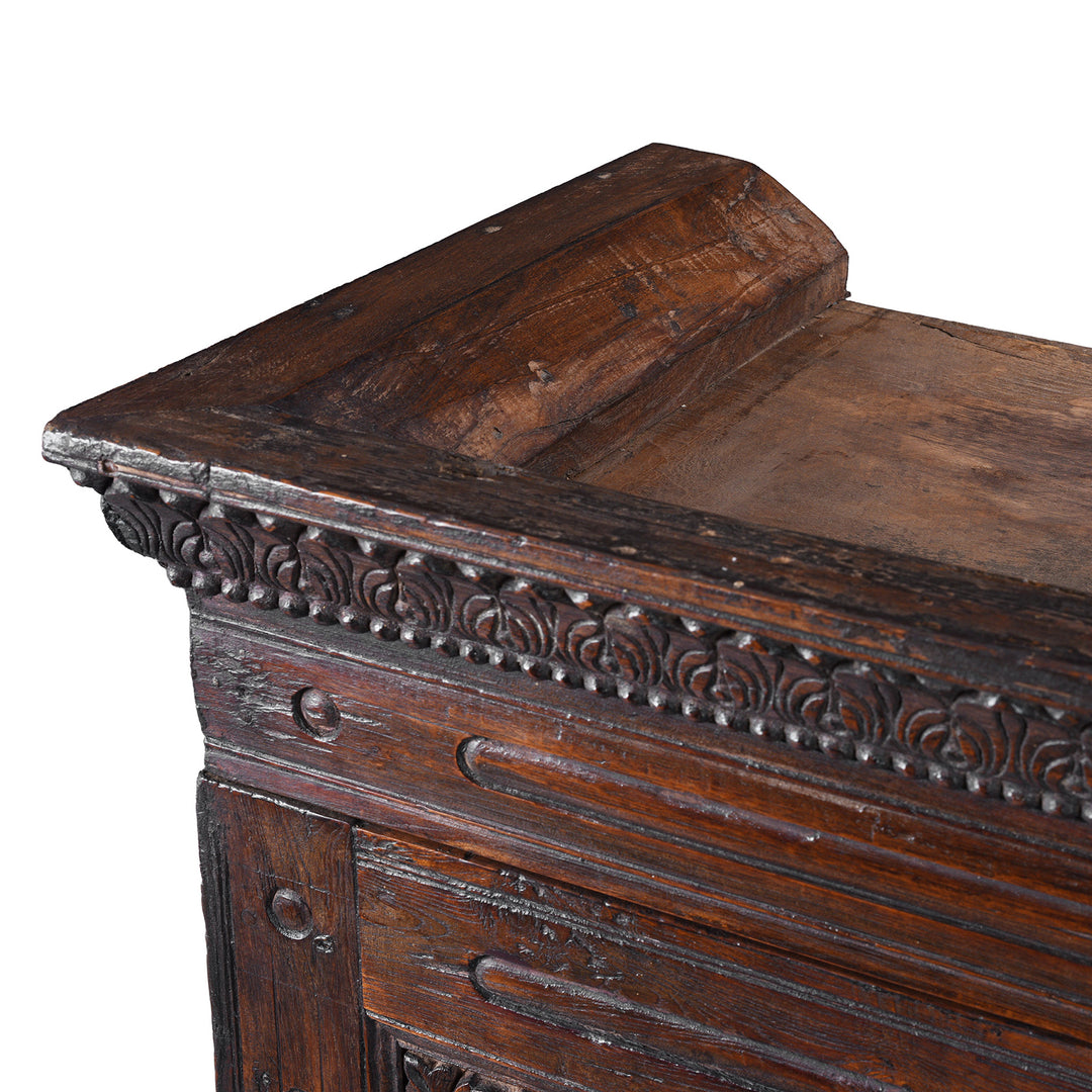 Detail From The Top Of 19th Century Indian Teak Almirah Cabinet With Deeply Carved Sunburst Panels And Indo Portuguese Influence