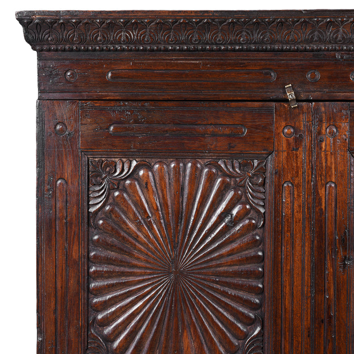 Corner Detail From 19th Century Indian Teak Almirah Cabinet With Deeply Carved Sunburst Panels And Indo Portuguese Influence