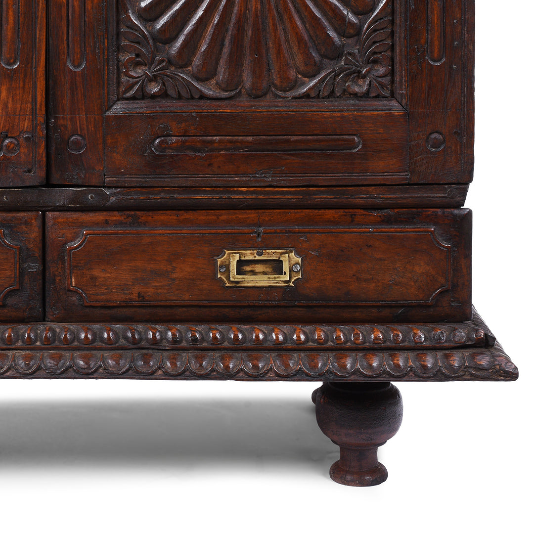 Leg And Drawer Detail From 19th Century Indian Teak Almirah Cabinet With Deeply Carved Sunburst Panels And Indo Portuguese Influence