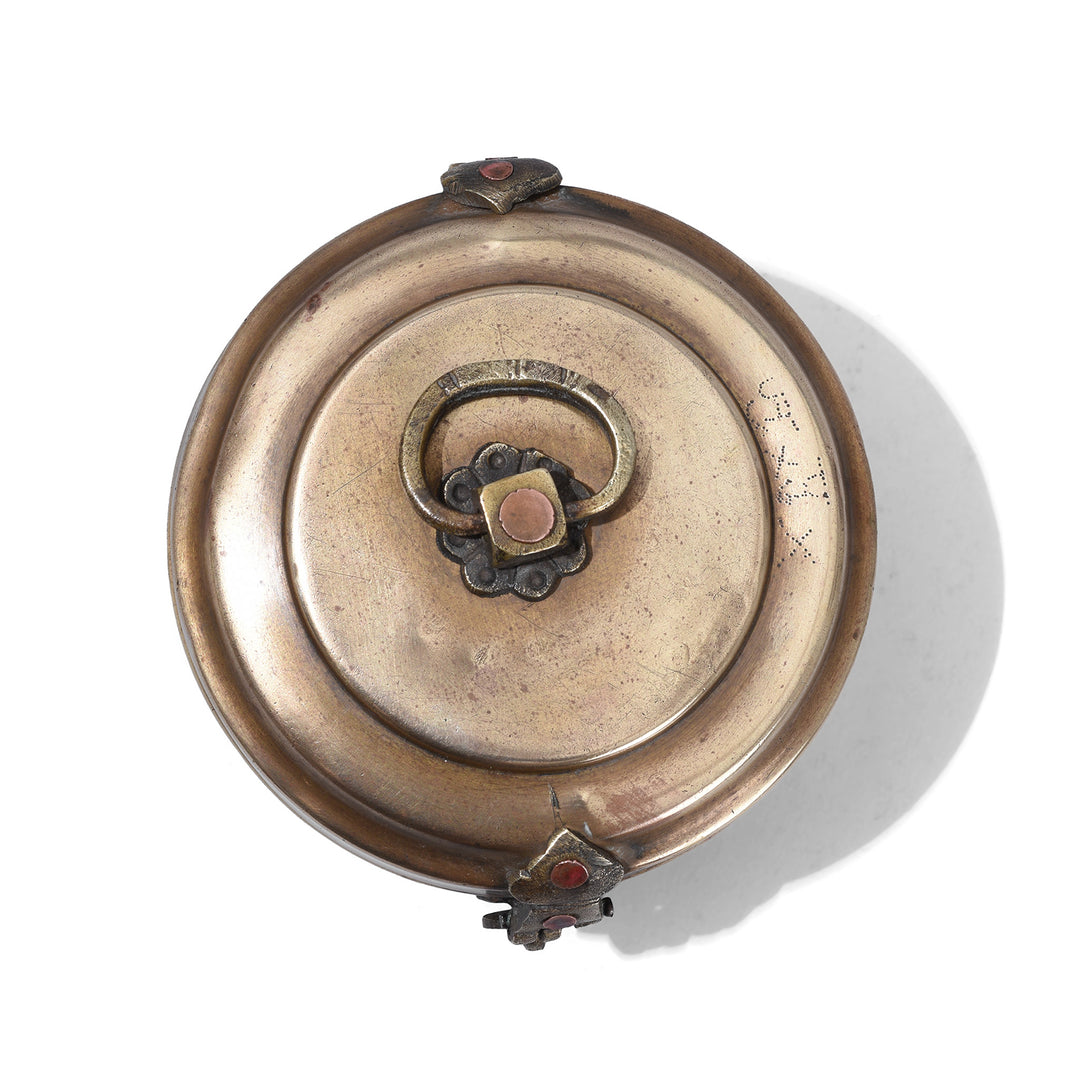 Top Down View Of Small Indian Brass Chapati Box With Ring Handle And Decorative Clasp Circa 1930s Vintage Kitchen Storage Container