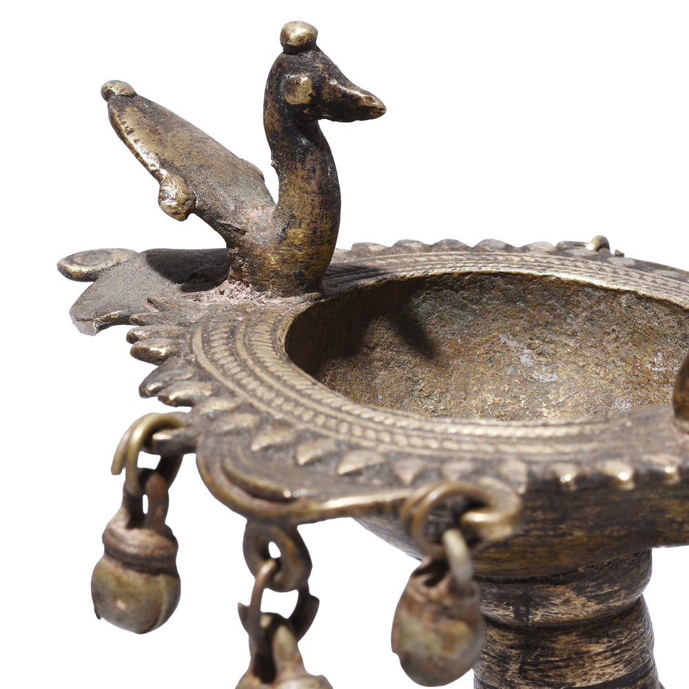 Peacock Detail From Circa 1920 Dhokra Brass Oil Lamp From Chhattisgarh With Peacock Finial And Suspended Bell Ornaments Cast Using Lost Wax Technique