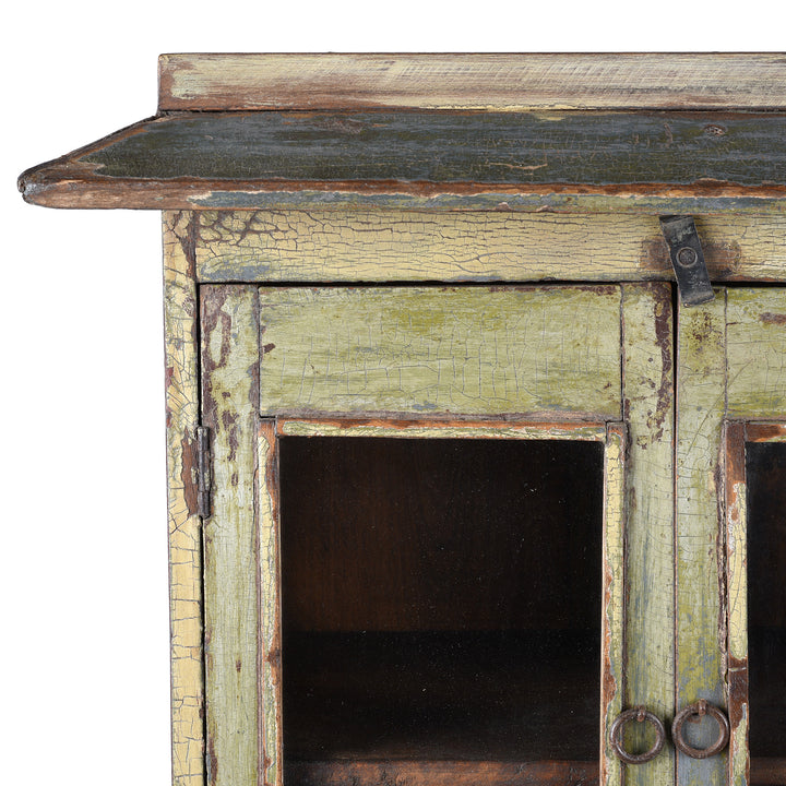 Detail of Patina From Green Painted 19th Century Indian Wall Cabinet With Glazed Doors And Drawer