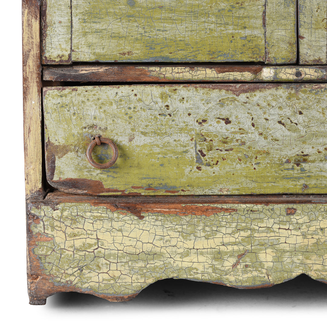 Corner Detail From Green Painted 19th Century Indian Wall Cabinet With Glazed Doors And Drawer