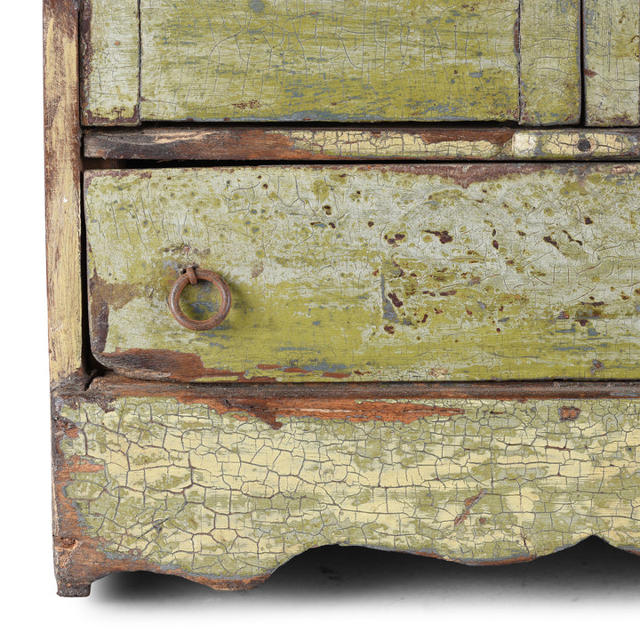 Corner Detail From Green Painted 19th Century Indian Wall Cabinet With Glazed Doors And Drawer