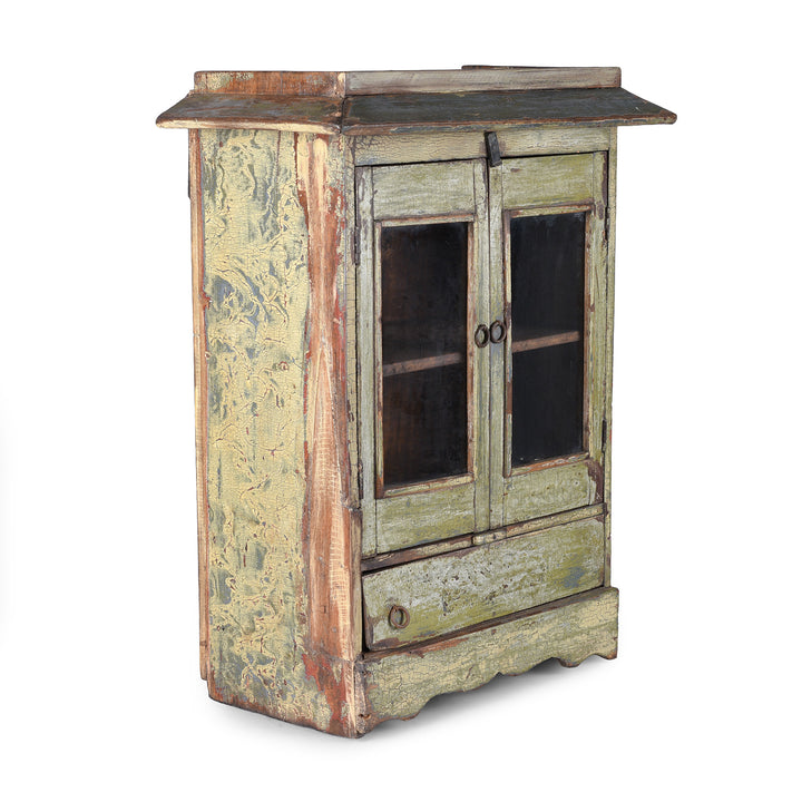 Angled View Of Green Painted 19th Century Indian Wall Cabinet With Glazed Doors And Drawer