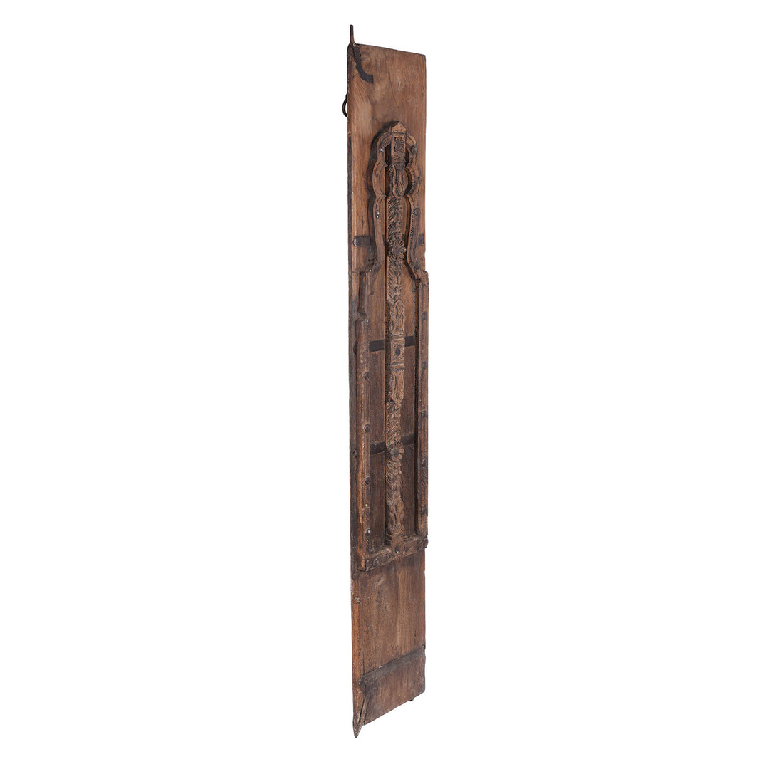 Angled VIew Of 19th Century Teak Window Shutter From Bikaner With Hand Carved Mughal Arch Detail And Aged Patina
