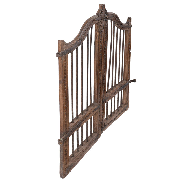 Angled VIew Of 19th Century Carved Teak Haveli Dog Gate From Gujarat With Iron Bars And Floral Detailing