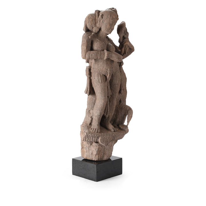 Angled View Of Carved Stone Apsara With Parrot | Indigo Antiques