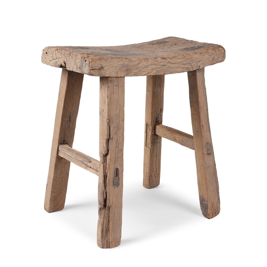 Angled View Of Antique Elm Saddle Stool From Shanxi | Indigo Antiques
