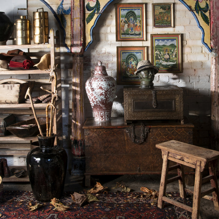 A rustic oriental interior with a Chinese and Indian art mix