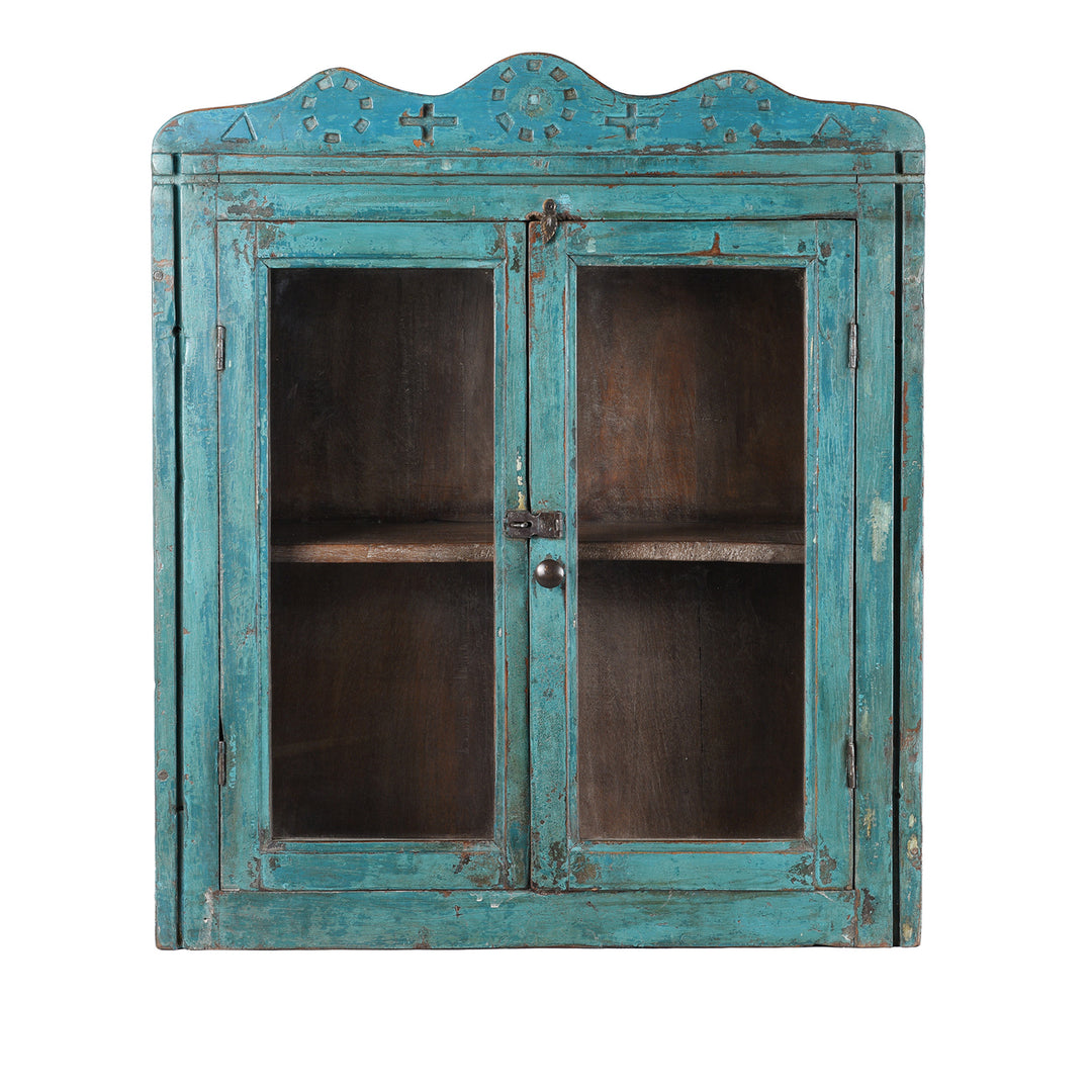 Blue Painted Teak Glazed Wall Cabinet Circa 1930 With Double Doors And Decorative Crest