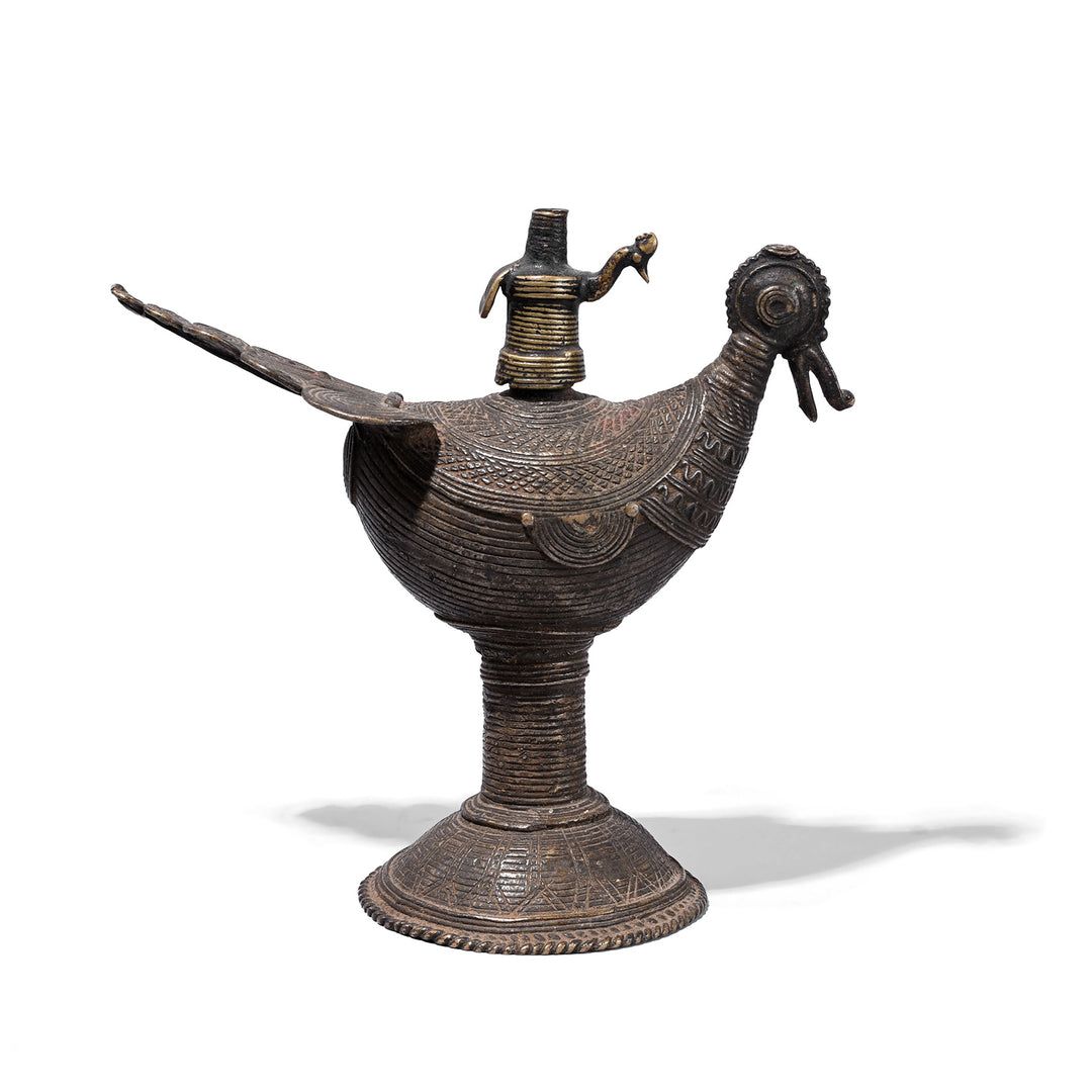 Brass Dhokra Peacock Oil Lamp From Orissa With Geometric Detailing And Aged Patina Circa 1920