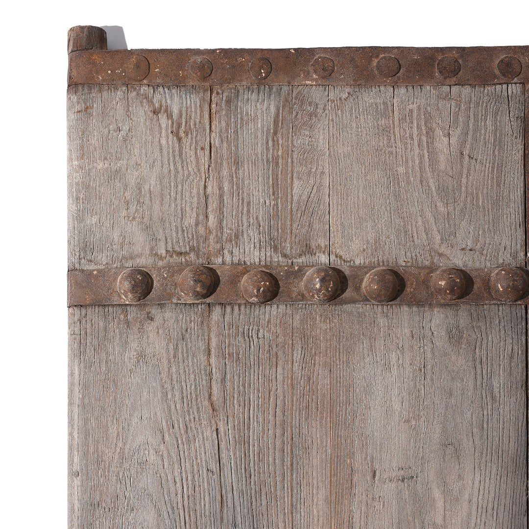 Corner post detail on an Antique Iron Chinese Bleached Elm Doors From Shanxi| Indigo Antiques