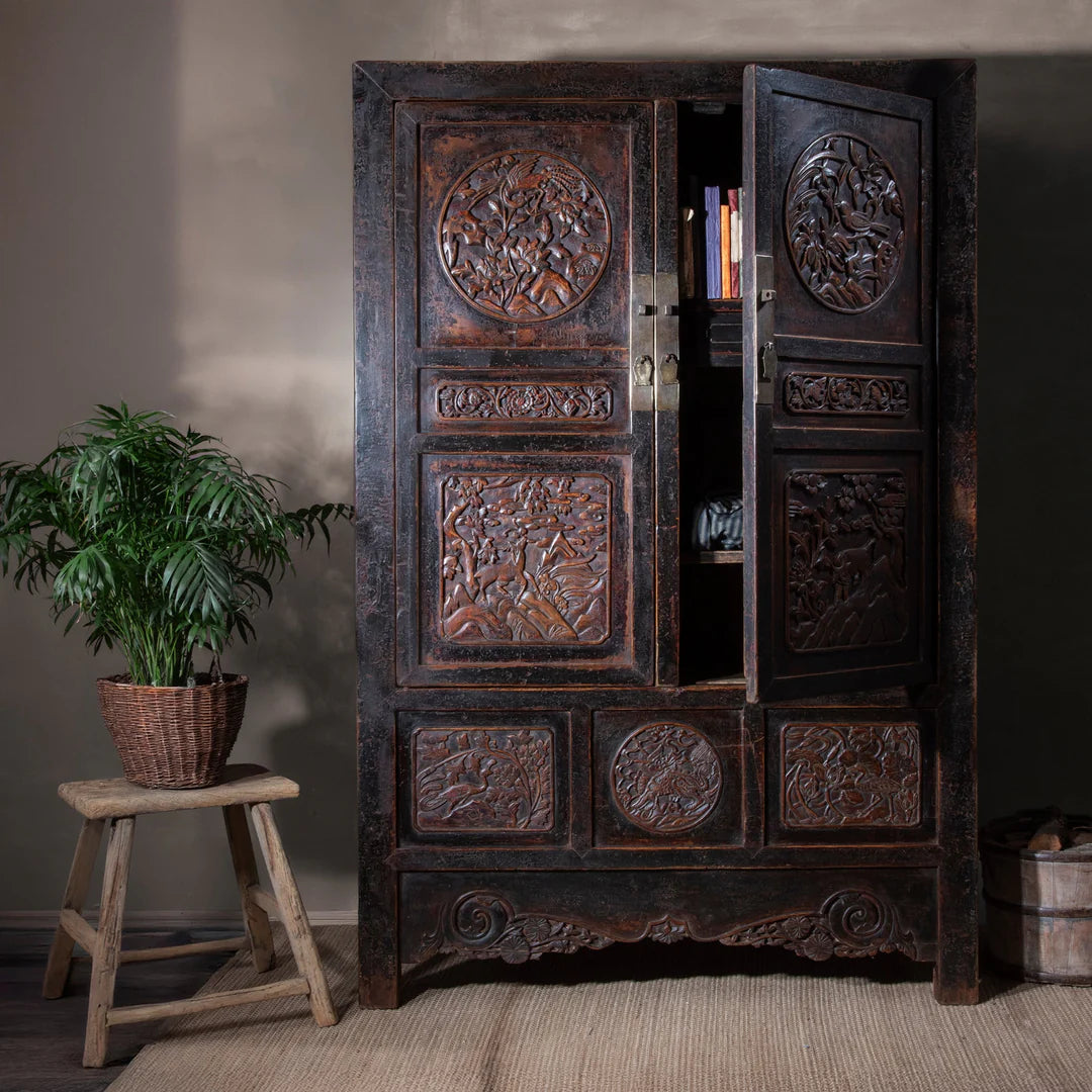 Dark wood antique cabinet in brown room