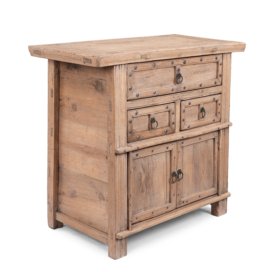 Angled View Of Bleached Elm Wood Cabinet From Shanxi China With Three Drawers And Lower Cupboard Featuring Iron Ring Pulls And Stud Detailing 19Th Century