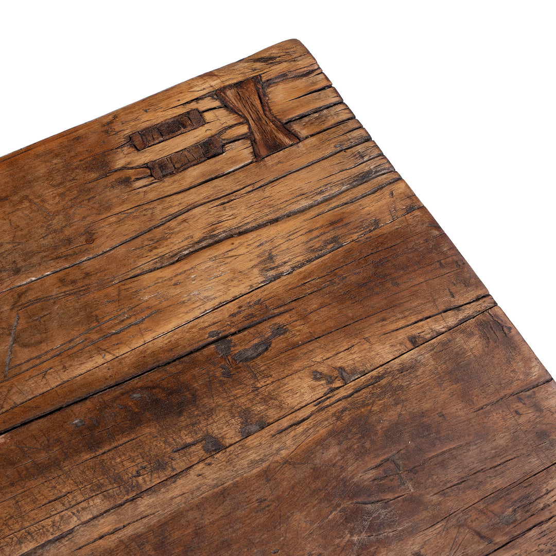 Detail From Antique circa 1910 Chinese walnut farmhouse coffee table from Henan with thick plank top, traditional mortise-and-tenon joinery and rich aged patina.