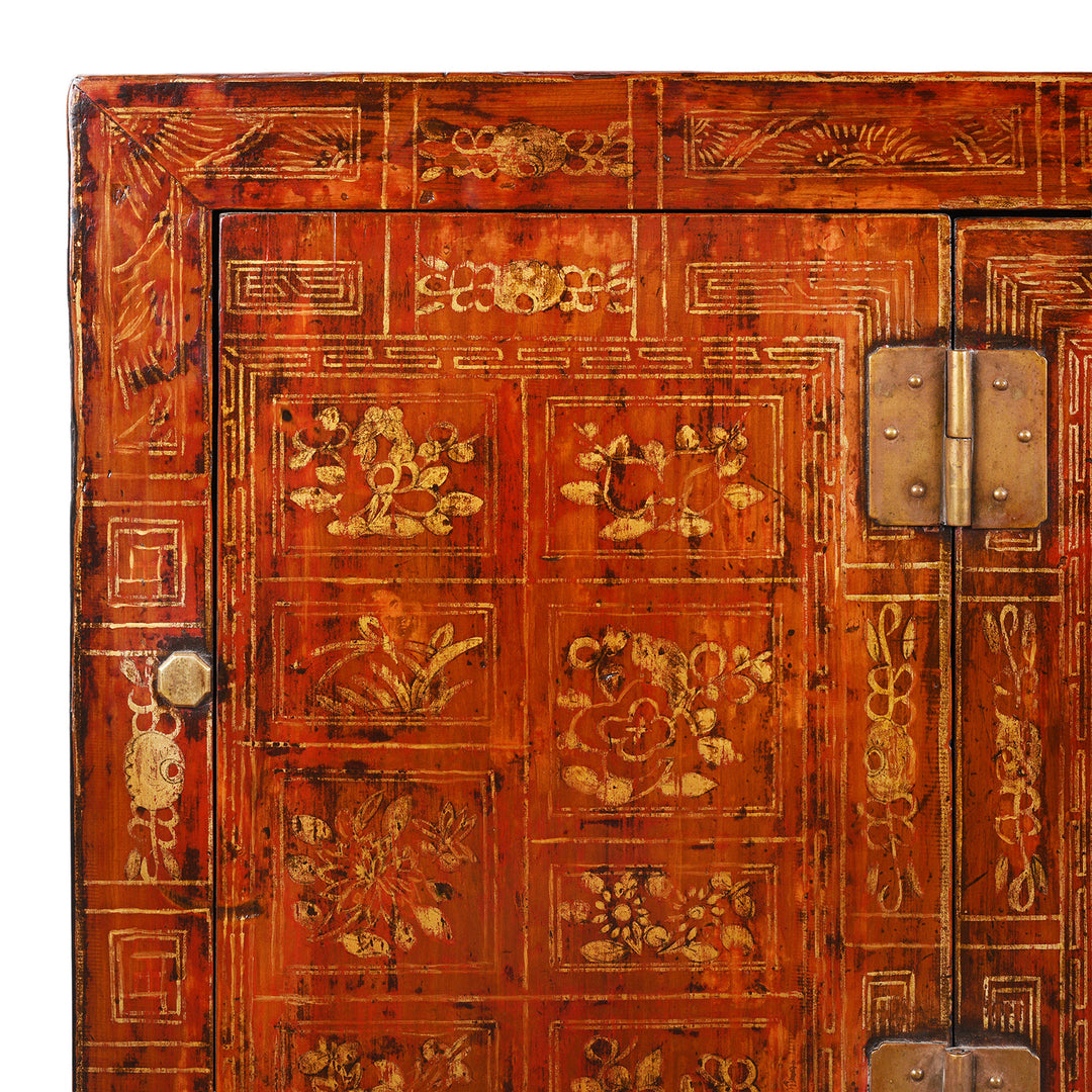 Detail of Paintwork From Red Lacquer Dongbei Sideboard With Gold Floral Motifs And Traditional Brass Hardware.