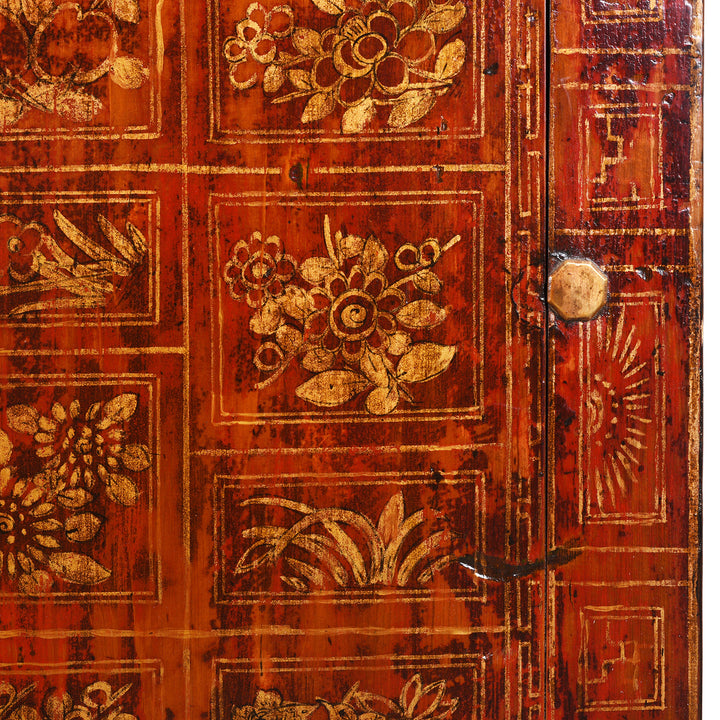 Detail Of Patina From Red Lacquer Dongbei Sideboard With Gold Floral Motifs And Traditional Brass Hardware.