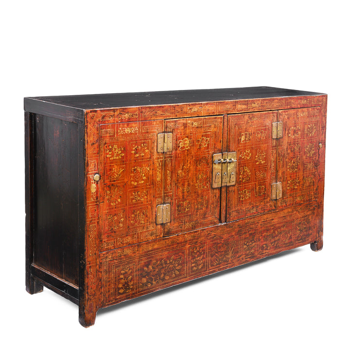 Angled View Of Red Lacquer Dongbei Sideboard With Gold Floral Motifs And Traditional Brass Hardware.