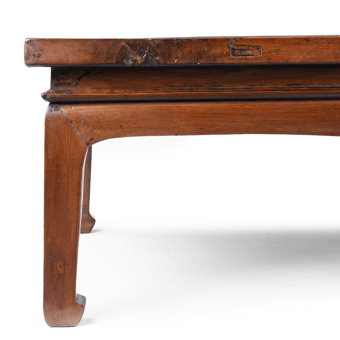Corner Detail From 19th Century Chinese Walnut Coffee Table From Gansu Province With Shaped Apron And Rich Aged Patina