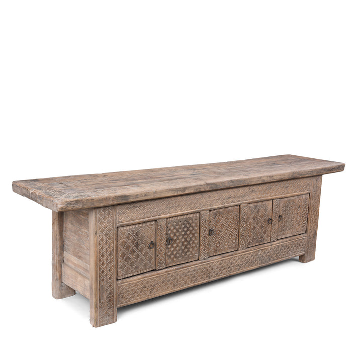 Angled VIew Of Carved 19th Century Xinjiang Low Sideboard Converted From Daybed With Geometric And Floral Carved Panels And Iron Ring Pulls | Indigo Antiques