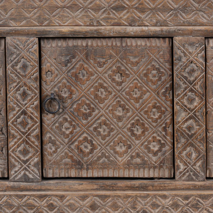 Carved Door Detail From Carved 19th Century Xinjiang Low Sideboard Converted From Daybed With Geometric And Floral Carved Panels And Iron Ring Pulls | Indigo Antiques