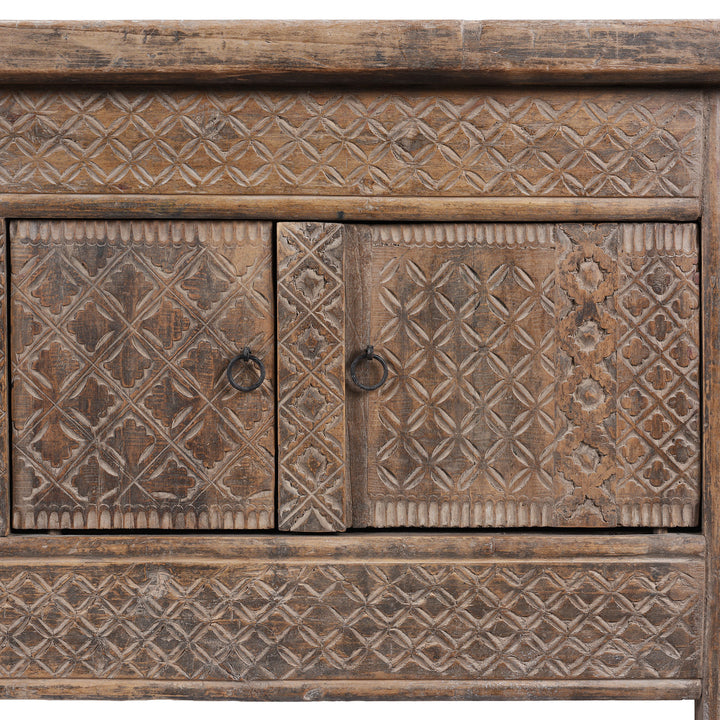 Carved Doors Detail From Carved 19th Century Xinjiang Low Sideboard Converted From Daybed With Geometric And Floral Carved Panels And Iron Ring Pulls | Indigo Antiques