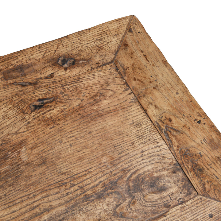 Patina Detail From Corner Of Antique Chinese Elm Console Table With Multiple Drawers And Rustic Aged Patina