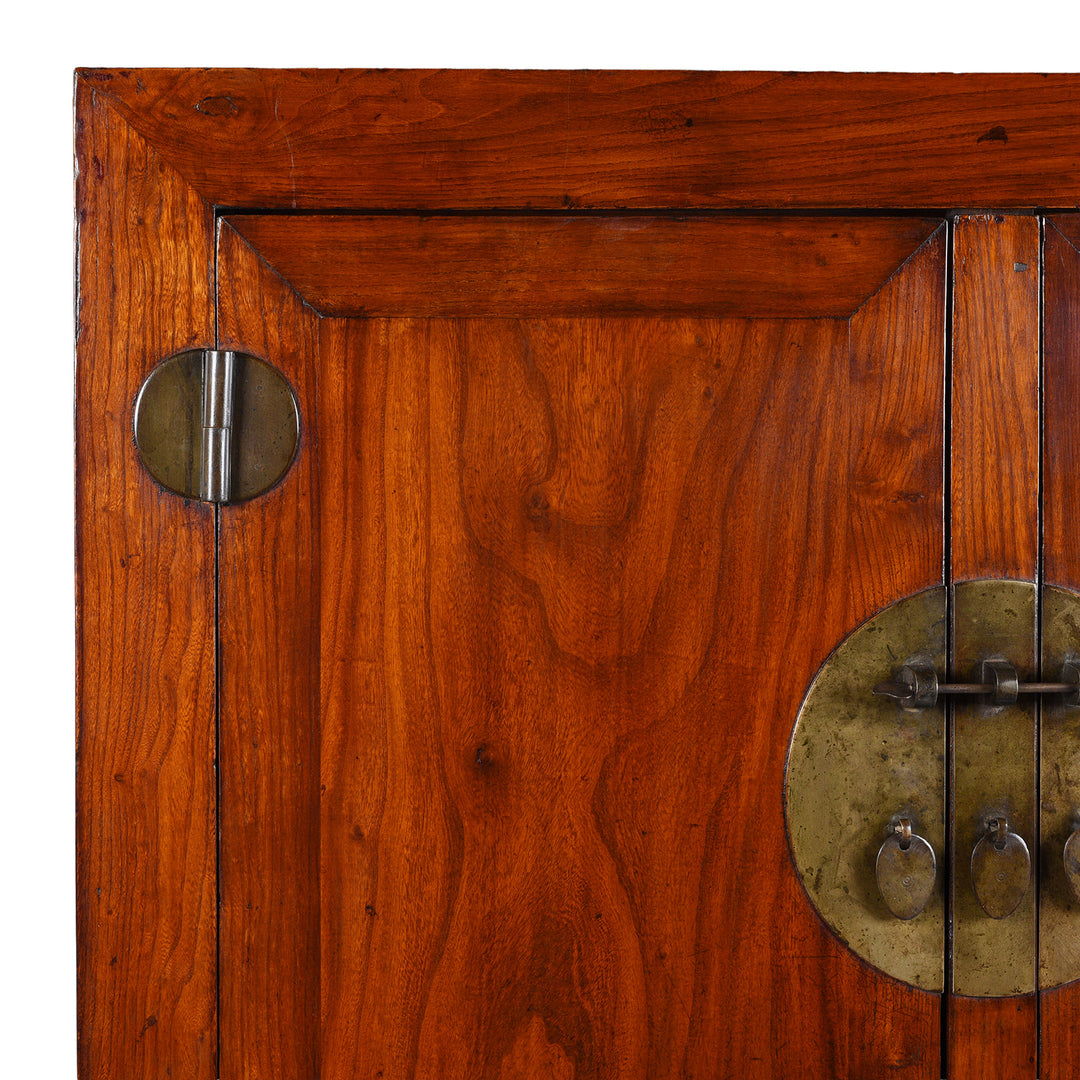 Corner Detail Showing Grain And Hinge Housing On Antique Chinese Elm Compound Cabinet With Brass Fittings And Carved Lower Panel