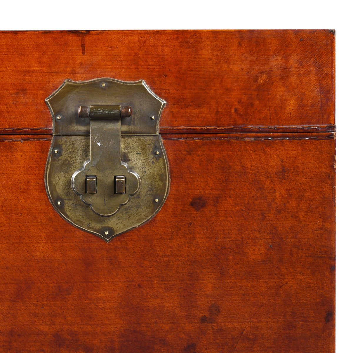 Corner Detail Displaying locking Plate From Antique Tan Leather Trunk From Shanghai | Indigo Antiques