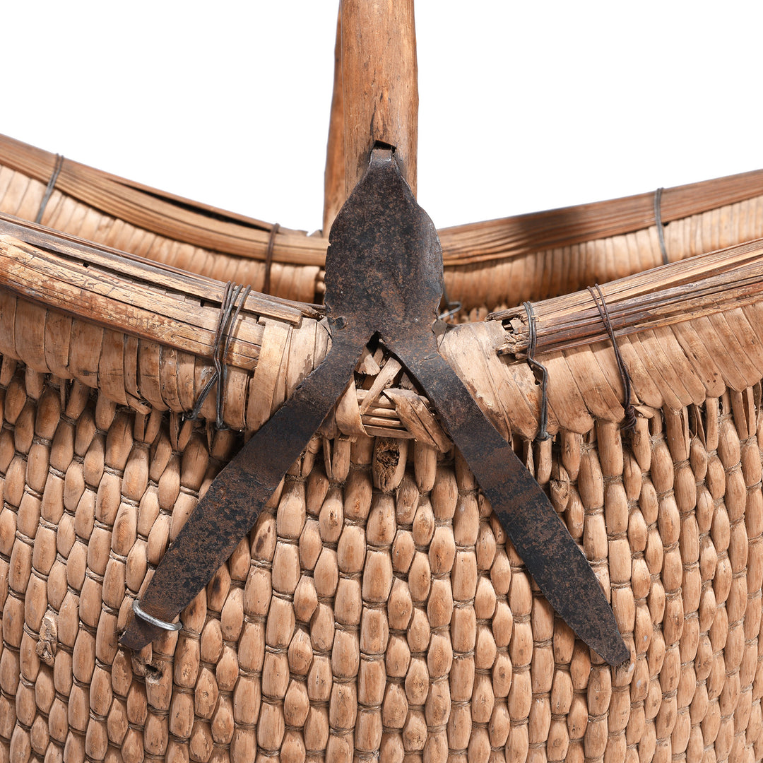 Handle Binding Detail From Vintage Chinese Woven Willow Basket With Wooden Handle And Metal Reinforcements