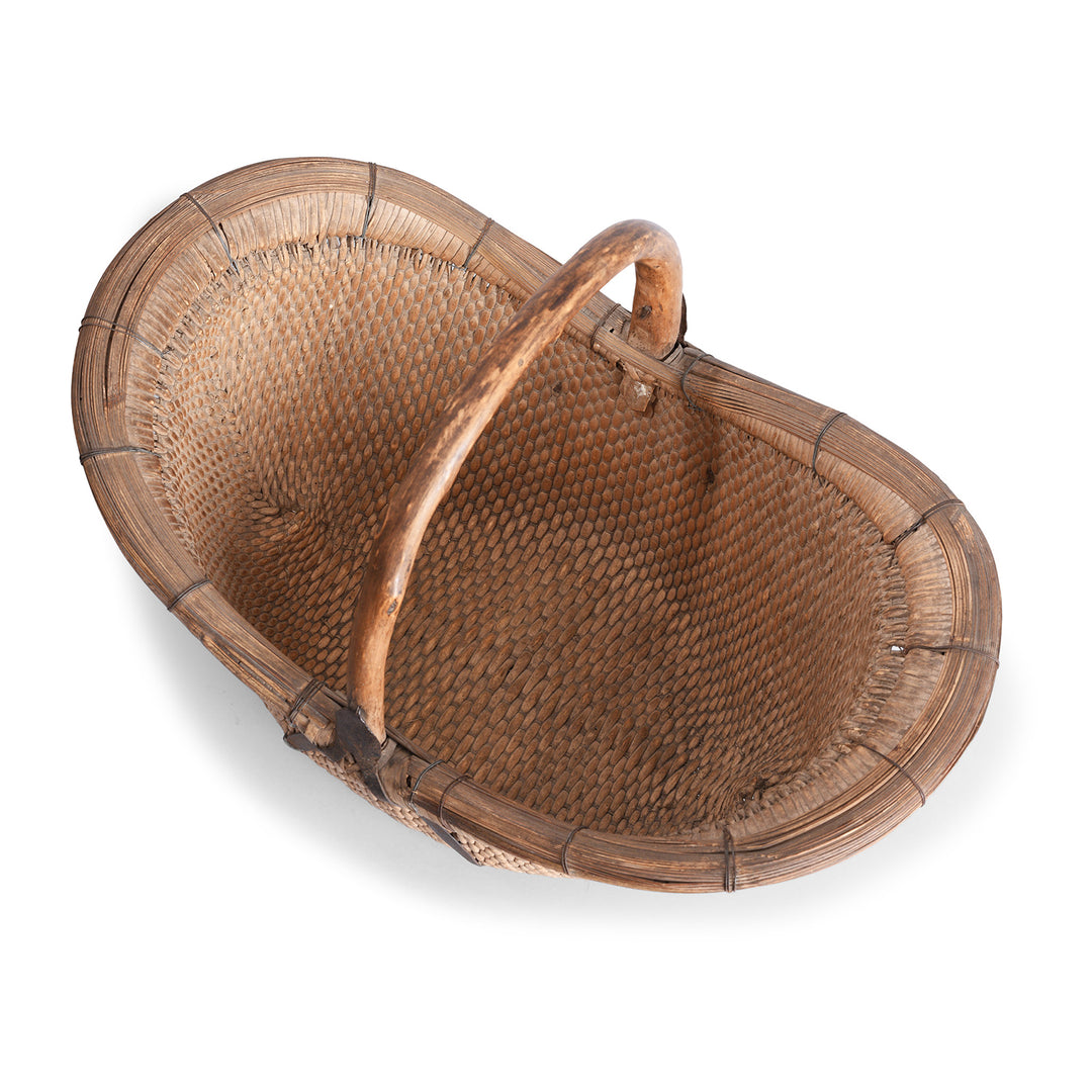 Interior Of Vintage Chinese Woven Willow Basket With Wooden Handle And Metal Reinforcements